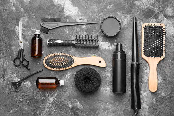 Set of hairdresser's accessories on grey background - Foto, Imagem