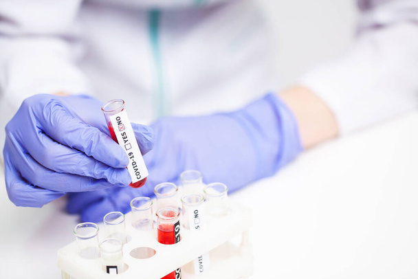 Woman at the hospital submits a blood test for a coronavirus - Zdjęcie, obraz