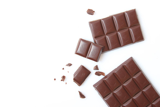 pieces of chocolate isolated on white. - 写真・画像