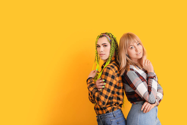 Portrait of young transgender couple on color background - Photo, Image