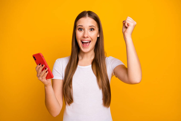 Omg i get hundred likes. Cheerful crazy addicted girl win social media lottery raise fists scream yes wear casual style stylish outfit isolated over bright shine color background - Foto, Bild