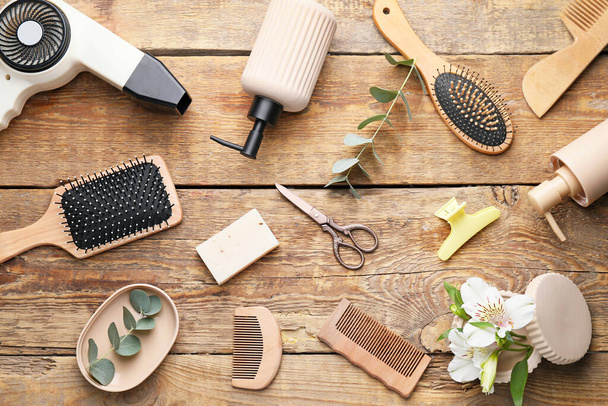 Set of hairdresser's accessories on wooden background - Photo, Image