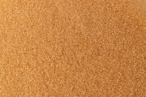 Pile of brown sugar texture background with copy space. Raw unrefined cane sugar pattern top view and flat lay - Photo, Image
