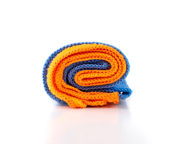 Blue and Orange Microfiber Cleaning Cloth Roll Isolated on White Background Closeup - Photo, Image
