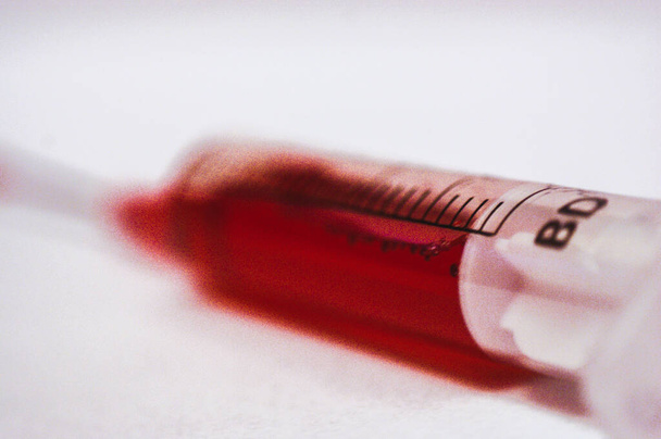 blood in syringe vaccine medicine sharp needle - Photo, Image