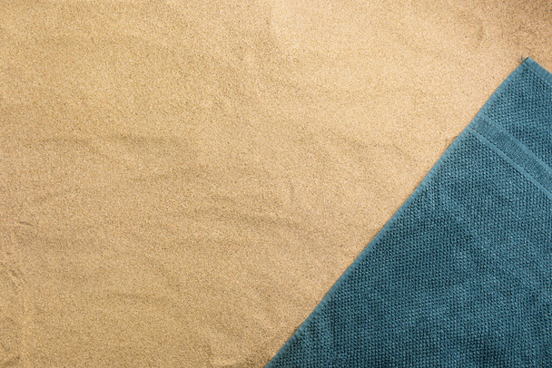 Summer vacation composition. Towel on sand background - Foto, Imagem