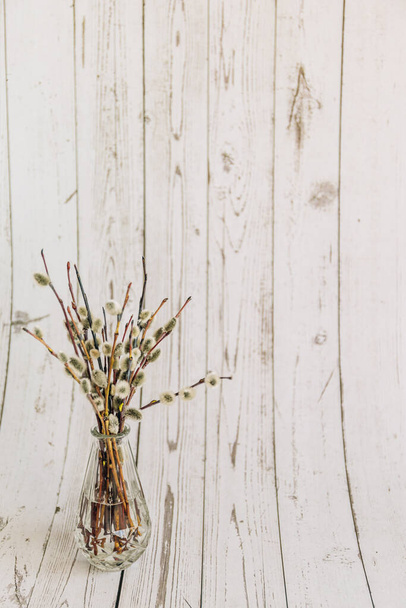 Pussy-willow branches with catkins, spring wooden background - Fotoğraf, Görsel