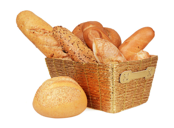 Large variety of bread in a wicker basket isolate on white background - Photo, Image