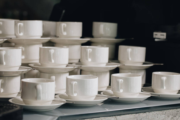 Group of empty coffee cups.Many rows of white cup for service tea or coffee in breakfast or buffet and seminar event. white cup in Catering and Cocktail - Fotoğraf, Görsel