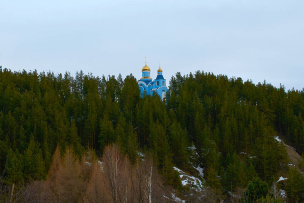Russian Orthodox Church on the mountain in the forest - Photo, Image