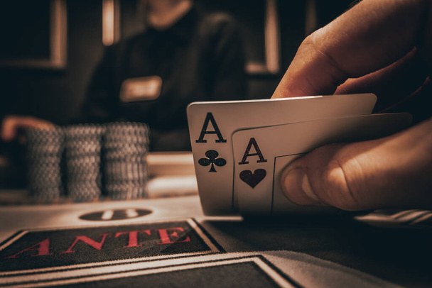 Casino Poker Chips Background with Copy Space. Poker Aces pair, Poker Hands. poker game. man's hand with a pair of aces. - 写真・画像