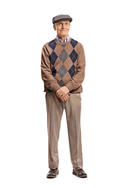 Full length portrait of a senior man standing and smiling at the camera isolated on white background - Фото, изображение