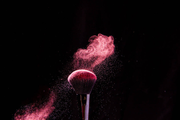 Cosmetic brushes in a bright palette of powder. Colorful explosion under makeup. - Fotoğraf, Görsel
