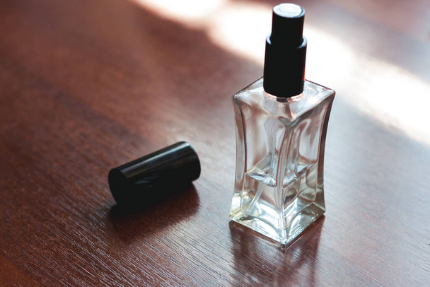 Bottle of perfume. Hand antiseptic on the table. Virus disinfection - Photo, Image