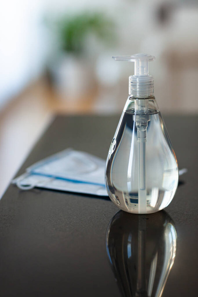 Antibacterial antiseptic hand sanitizer gel bottle and surgical masks - Photo, Image