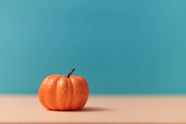 Orange pumpkin mockup, copy space. Gourd on blurred background. Symbol of autumn. Harvest festival. Halloween concept - Foto, imagen