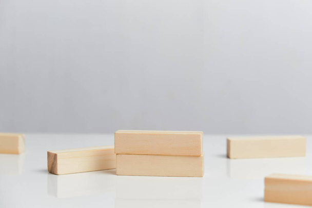 Bankruptcy concept. Wooden blocks on a white background background. Close up. - Photo, Image