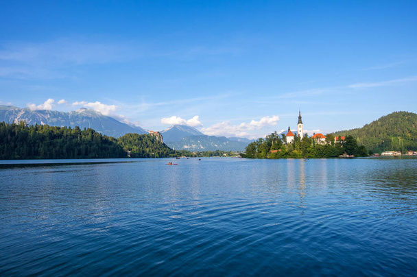 Amazing view on Bled Lake with church dedicated to the Assumption of Mary on a small island, Julian Alps, Slovenia - Photo, Image