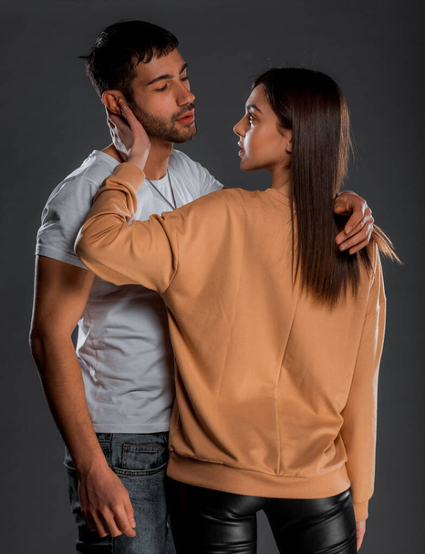 Portrait of sexy young male and female models hugging passionately - Fotoğraf, Görsel