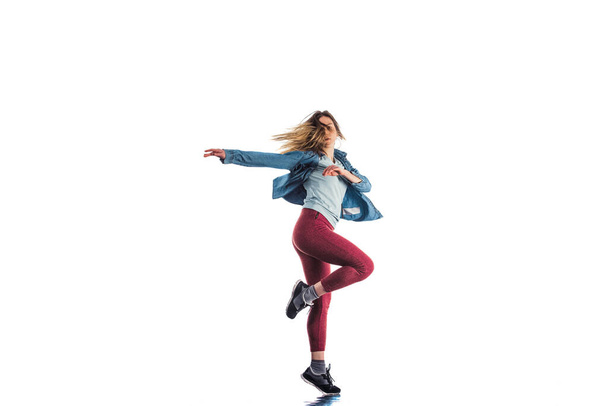 Modern girl doing break dance routine - Φωτογραφία, εικόνα