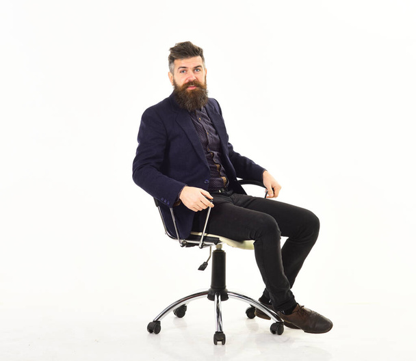 Employer sits in luxury chair and wear smart suit. - Φωτογραφία, εικόνα