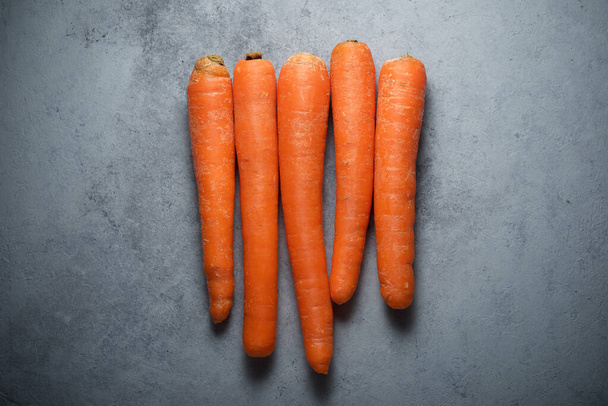 Carrots on a gray table. - Photo, Image