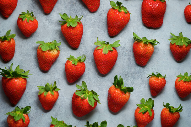 Strawberries on a gray table. - Foto, imagen