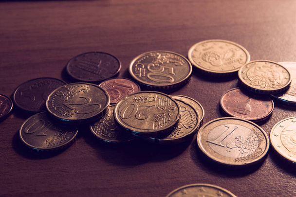 Scattered coins on table - money background - Foto, imagen
