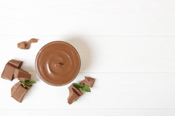 chocolate cream on the table. chocolate butter, chocolate paste. - Photo, Image