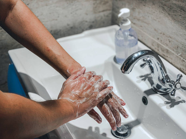 Coronavirus or Covid-19. Washing hands rubbing with soap man for corona virus prevention, hygiene to stop spreading coronavirus. - Photo, Image