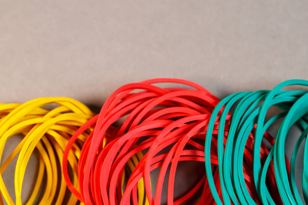 Colored rubber bands for money on a colored background. Stationery accessories - Photo, Image