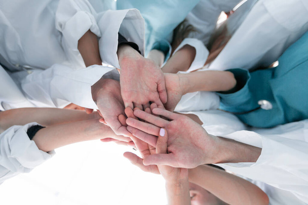 bottom view. group of diverse doctors showing their unity - Photo, Image