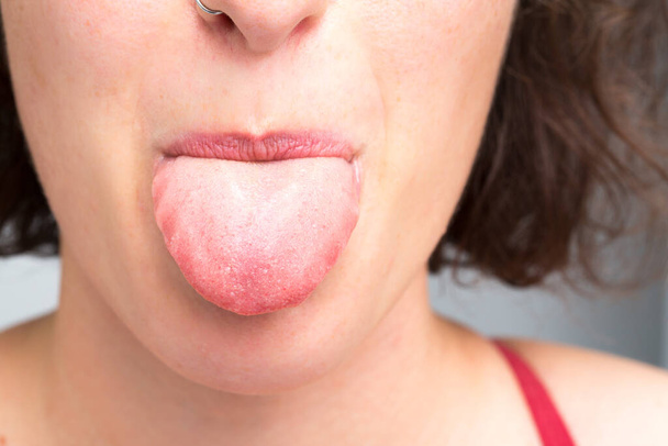 Close up of tongue of woman - Foto, Bild