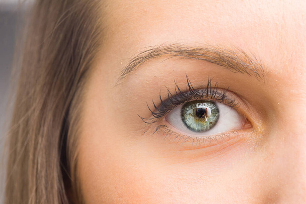 Close up of green eye of girl - Zdjęcie, obraz