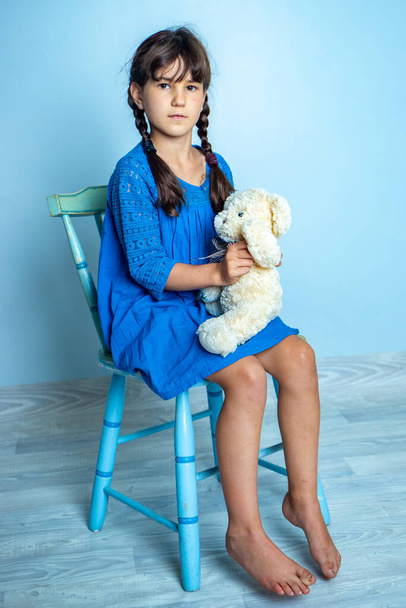 indoor portrait of young child girl with teddy bear, isoalted studio shot - Zdjęcie, obraz