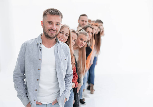 handsome guy standing in front of a group of young people - Фото, зображення
