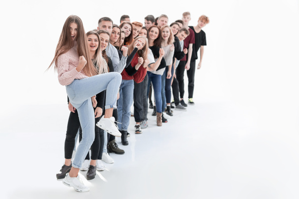 confident young woman standing in front of a column of young people - Foto, afbeelding