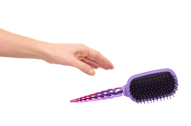 Hand with purple hairbrush, hair care and beauty. Isolated on white background. - Photo, image