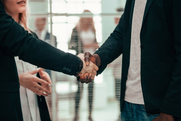close up. business people greeting each other with a handshake. - Fotó, kép