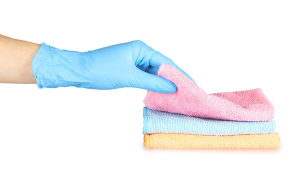 Colored cleaning rag with hand in rubber glove. Isolated on white background. - Fotó, kép