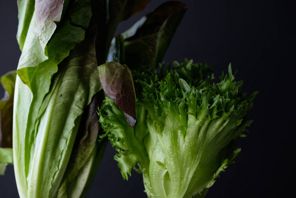 Lettuce on a dark background, healthy eating concept - Фото, зображення