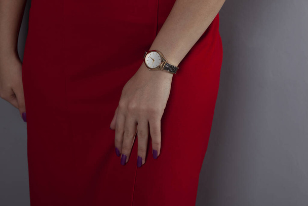 fashionable woman hand in waist on gray background - Fotó, kép