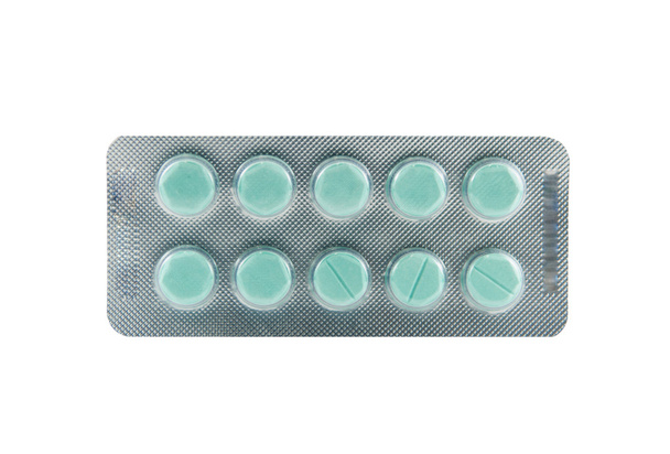 grüne Tablette in Blisterverpackung - Foto, Bild
