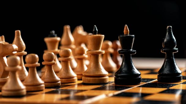 Vintage wooden chess board and figures - 写真・画像