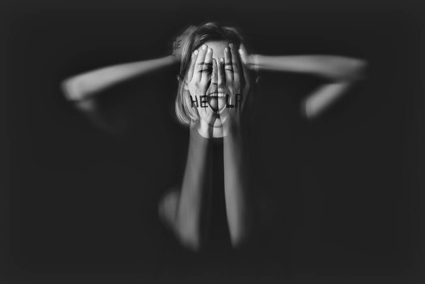 Woman having panic attack on dark background - Photo, Image
