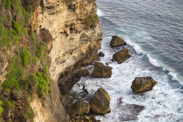 Spectacular view from Uluwatu cliff at sunset in Bali, Indonesia - Photo, Image