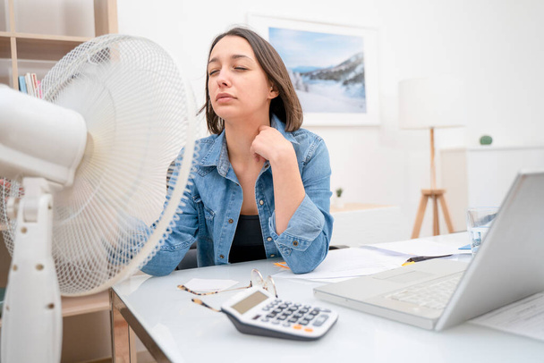 Woman feeling sweat and refreshing during summer heatwave - Фото, зображення