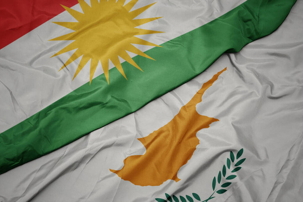 sventolando bandiera colorata di Cipro e bandiera nazionale del kurdistan. macro
 - Foto, immagini