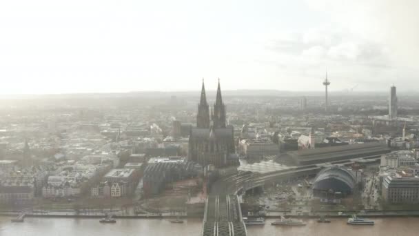 AERIAL: Cologne Hohenzollern Bridge and View on Cathedral with Central Train Station in beautiful hazy Sunlight  - Footage, Video
