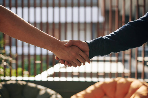 Close-up image of business executives shaking hands after making a deal - Photo, Image